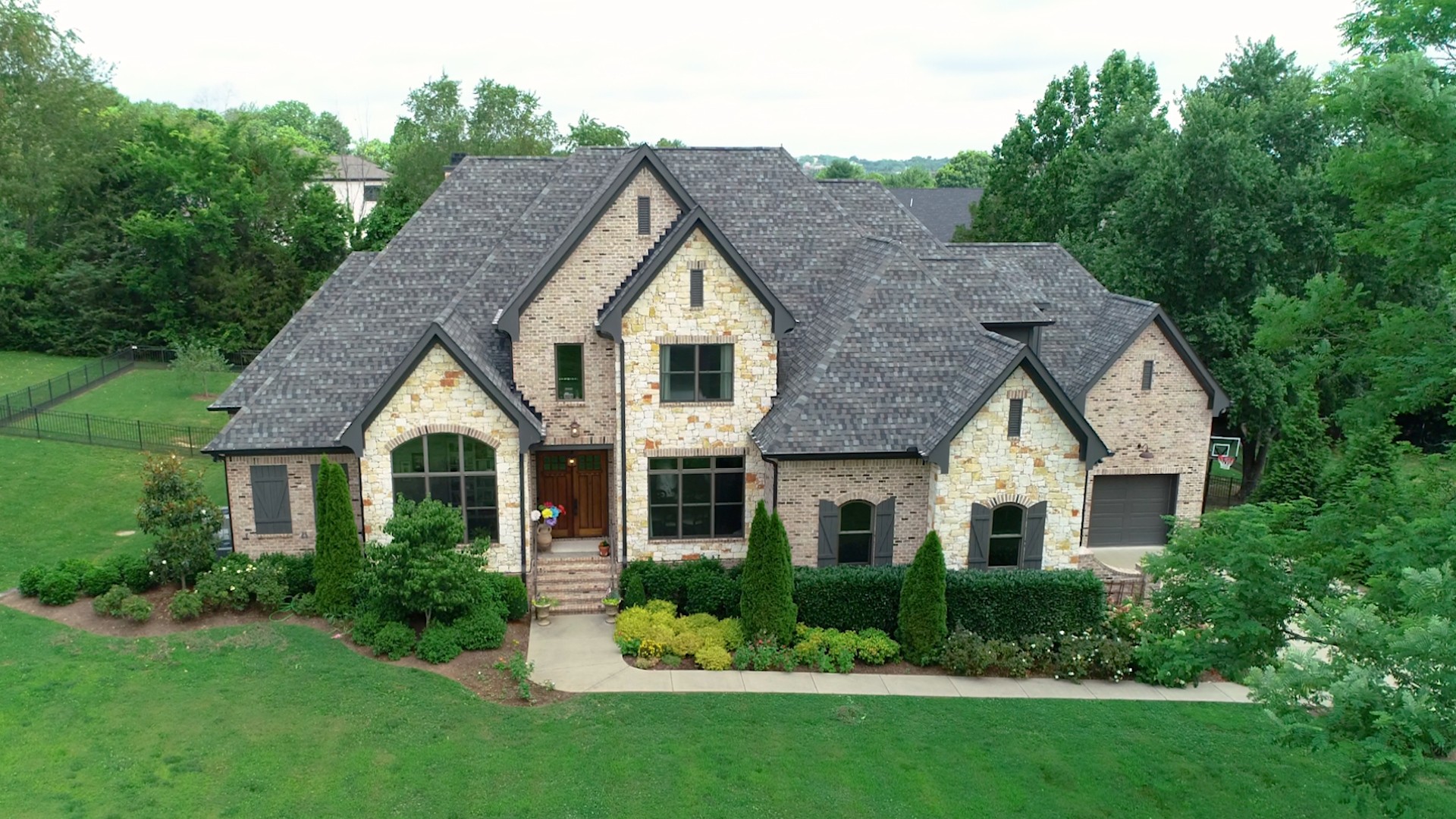 1110 Ridgeway Drive Franklin, TN 37067 - Photo 46 of 48 a front view of a house with a yard and green space