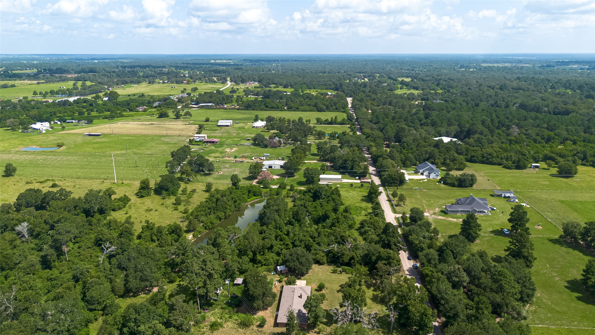 30525 Hegar Road Hockley, TX 77447 - Photo 42 of 49 an aerial view of residential houses with outdoor space and trees