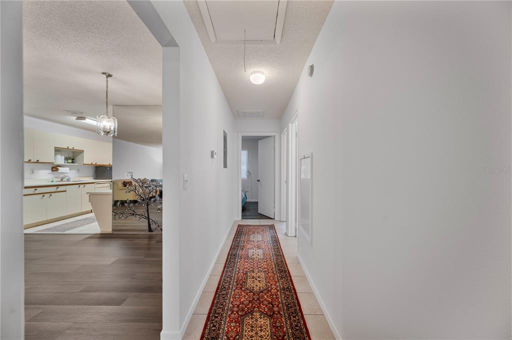 205 Winter Ridge Boulevard Winter Haven, FL 33881 - Photo 19 of 36 a view of a kitchen from the hallway