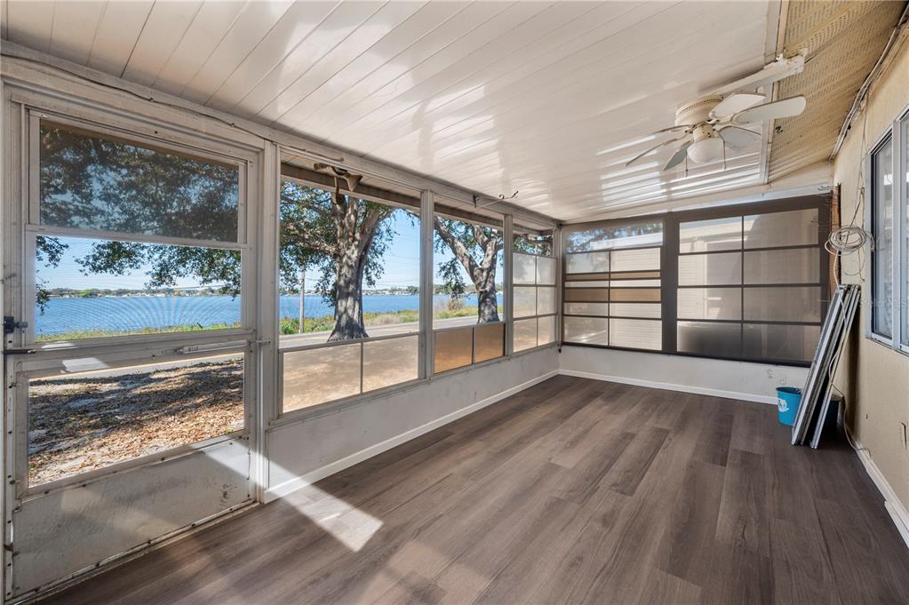 205 Winter Ridge Boulevard Winter Haven, FL 33881 - Photo 20 of 36 a view of empty room with wooden floor and fan