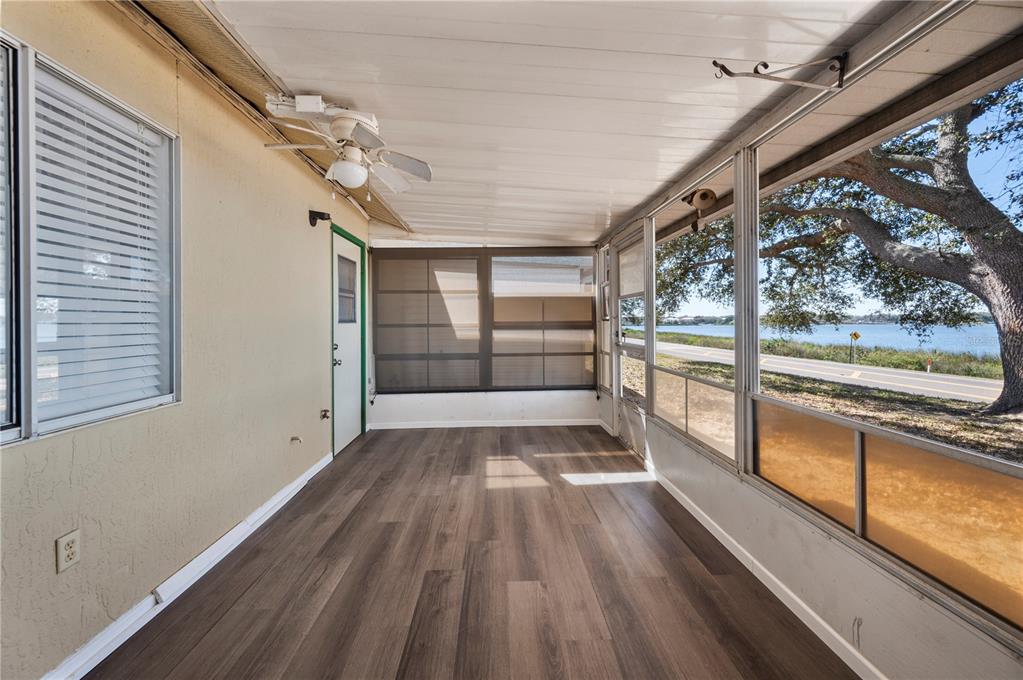 205 Winter Ridge Boulevard Winter Haven, FL 33881 - Photo 21 of 36 a view of empty room with wooden floor and fan