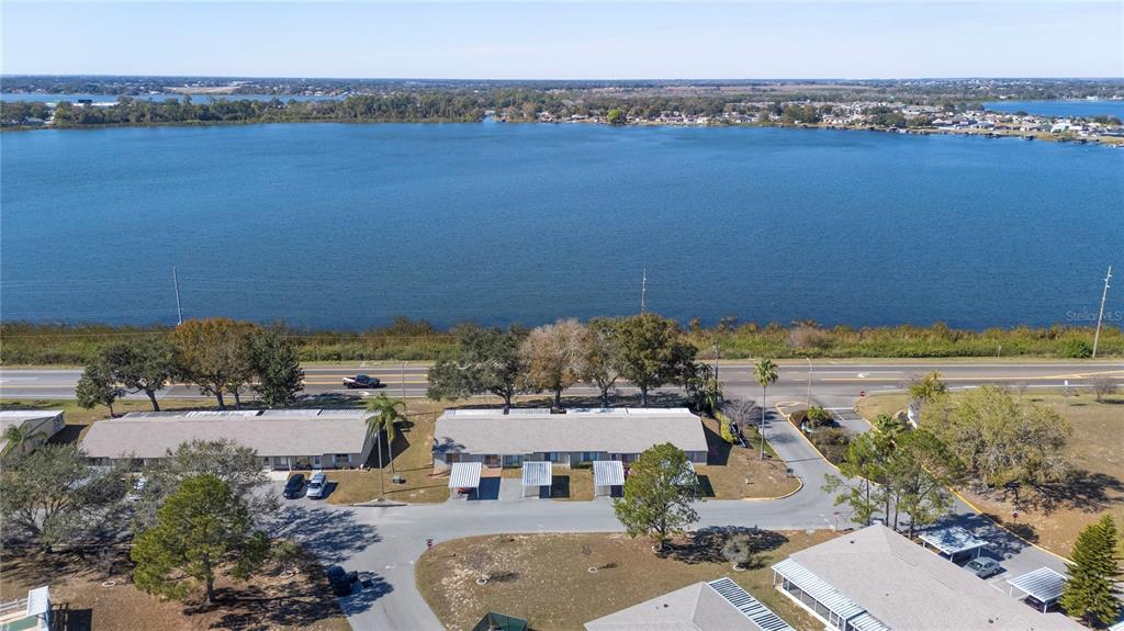 205 Winter Ridge Boulevard Winter Haven, FL 33881 - Photo 25 of 36 an aerial view of a house with a lake view