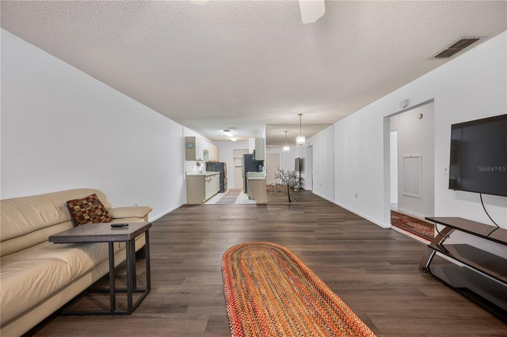 205 Winter Ridge Boulevard Winter Haven, FL 33881 - Photo 4 of 36 a view of a livingroom with furniture and a flat screen tv