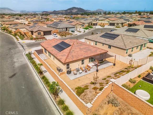 an aerial view of residential houses with outdoor space