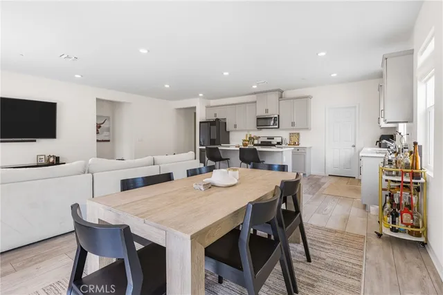 a view of kitchen with cabinets and wooden floor