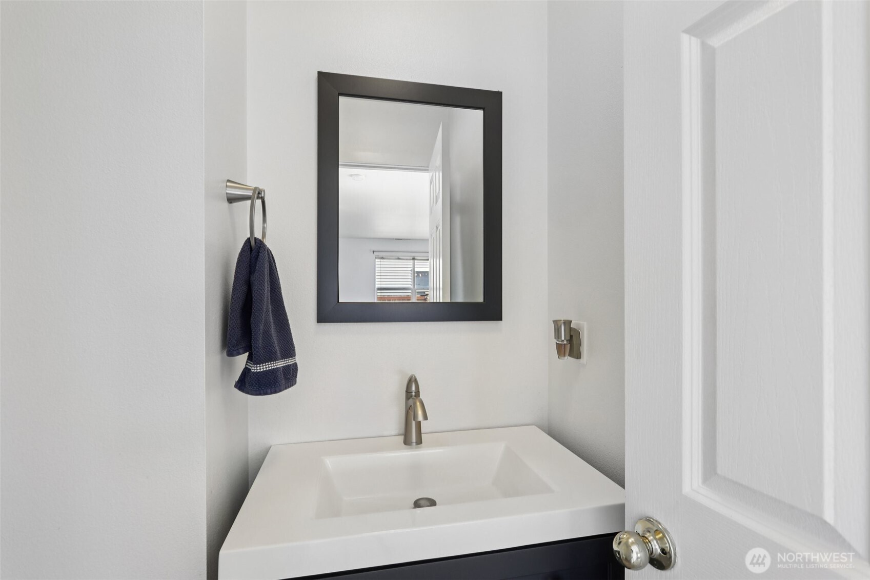 114 Weaver Street Northeast Orting, WA 98360 - Photo 19 of 40 a bathroom with a sink and a mirror