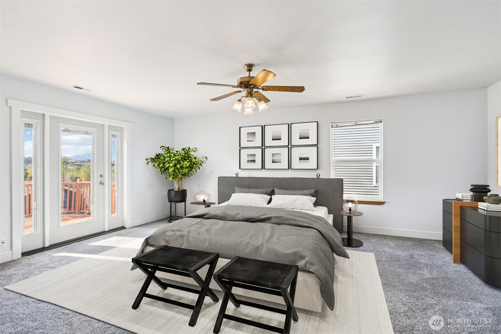 114 Weaver Street Northeast Orting, WA 98360 - Photo 20 of 40 a bedroom with a bed and a chandelier