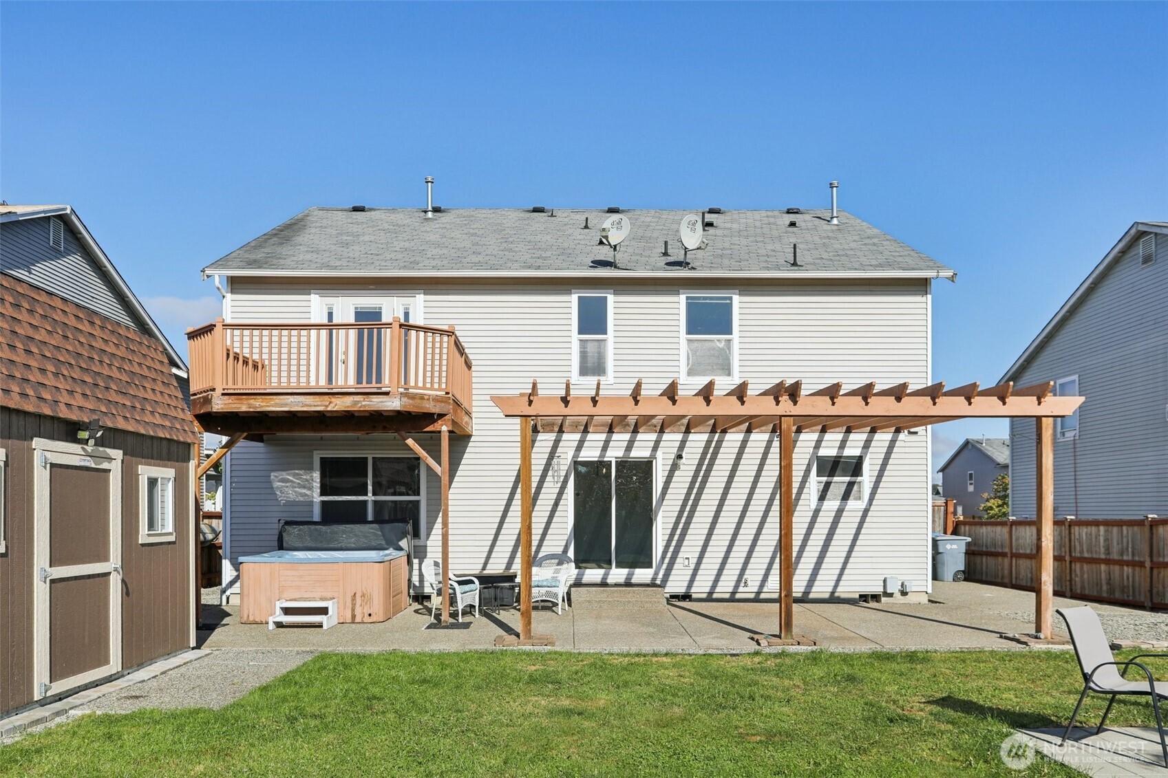 114 Weaver Street Northeast Orting, WA 98360 - Photo 35 of 40 a view of a house with a yard and sitting area