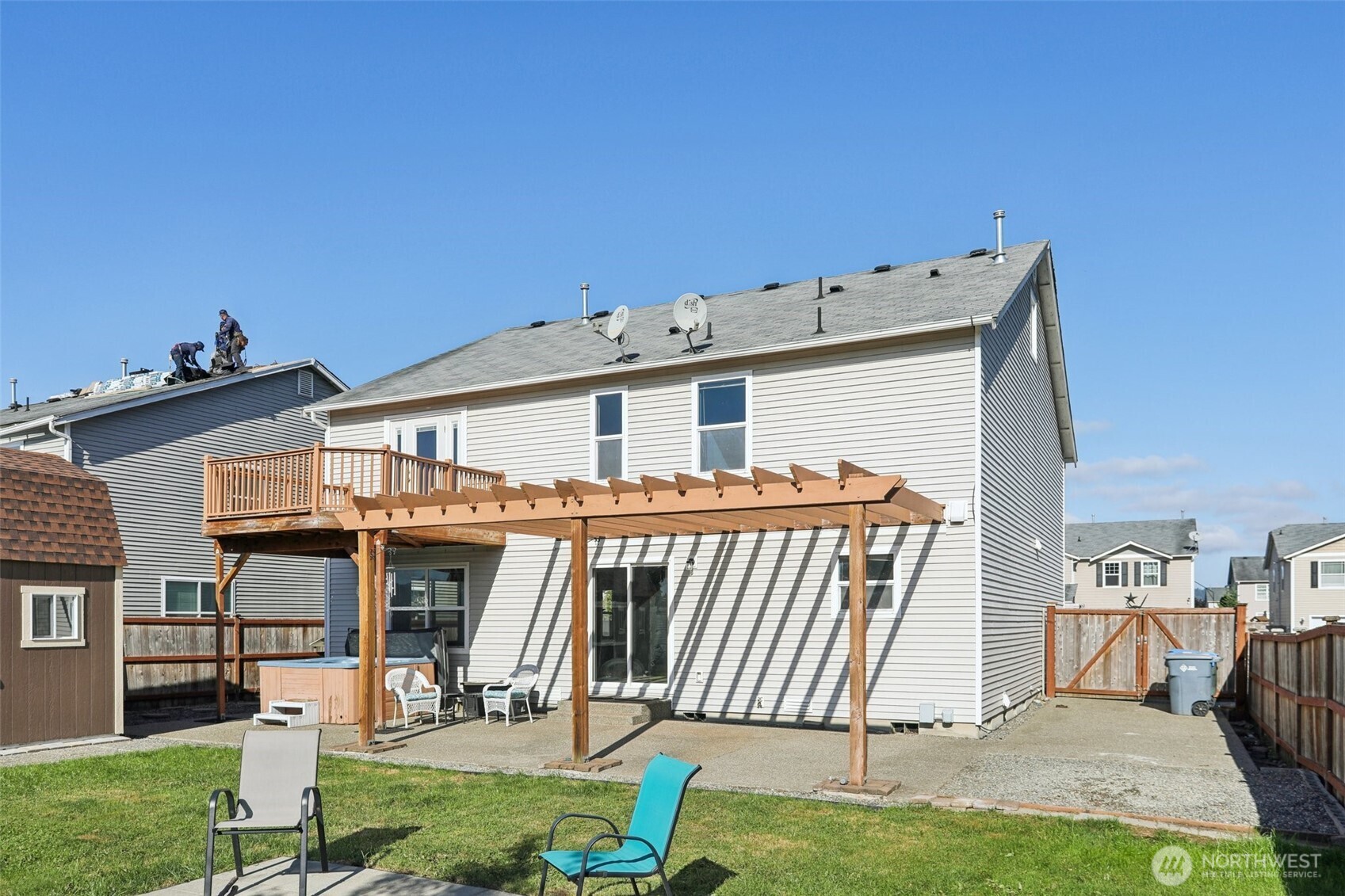 114 Weaver Street Northeast Orting, WA 98360 - Photo 36 of 40 a view of a house with backyard porch and furniture