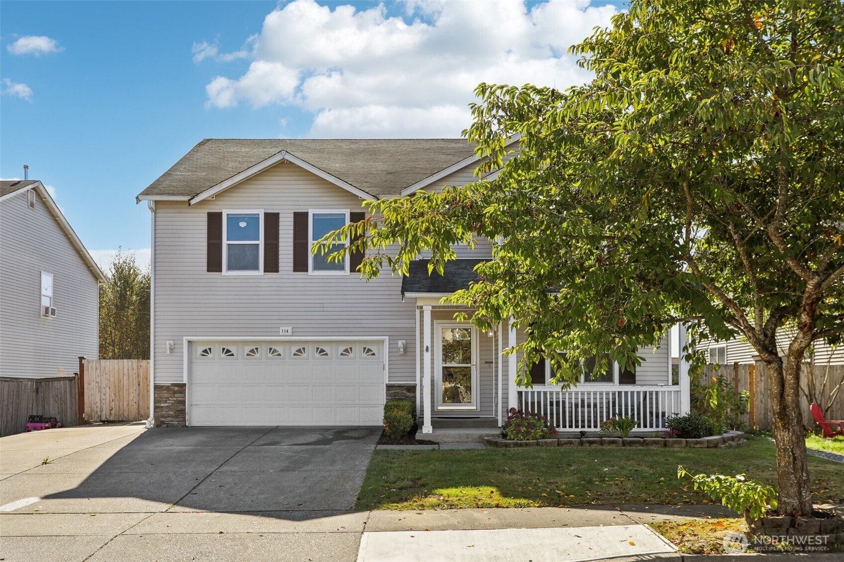 114 Weaver Street Northeast Orting, WA 98360 - Photo 40 of 40 a front view of a house with a yard