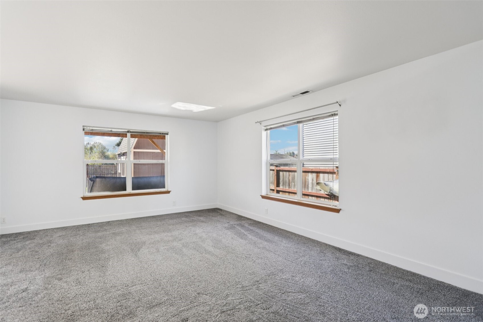 114 Weaver Street Northeast Orting, WA 98360 - Photo 7 of 40 an empty room with a window