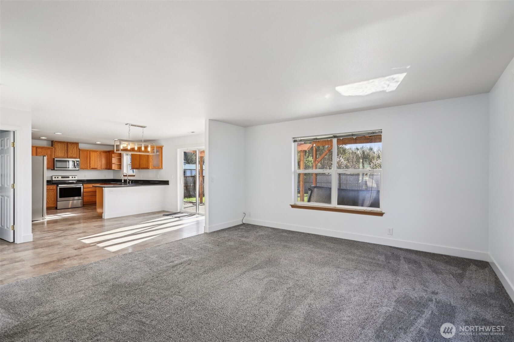 114 Weaver Street Northeast Orting, WA 98360 - Photo 9 of 40 a view of an empty room with a window