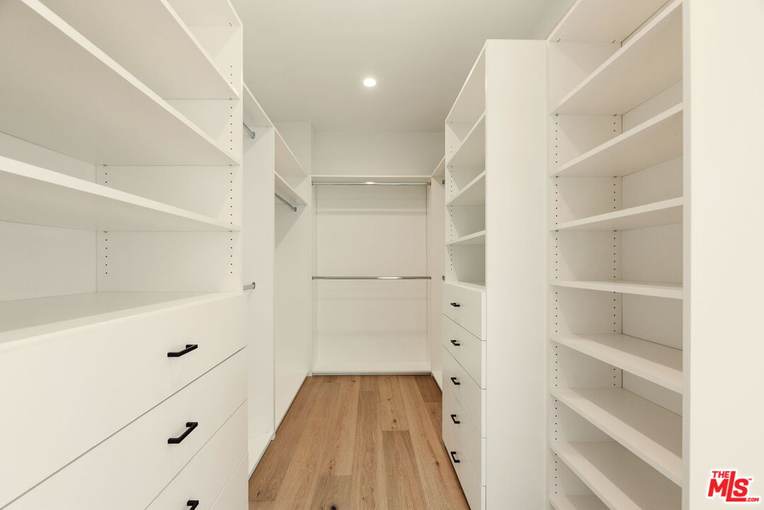 2165 Little Las Flores Road Topanga, CA 90290 - Photo 16 of 40 a view of walk in closet with empty racks