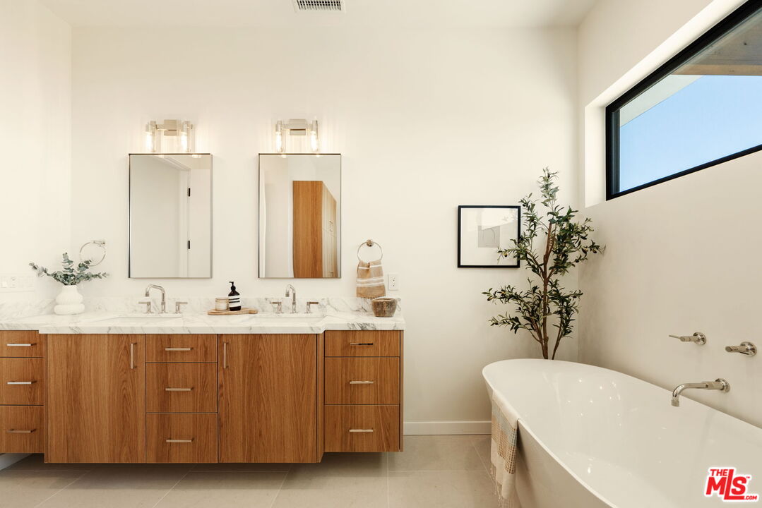 2165 Little Las Flores Road Topanga, CA 90290 - Photo 18 of 40 a bathroom with a double vanity sink mirror and bathtub