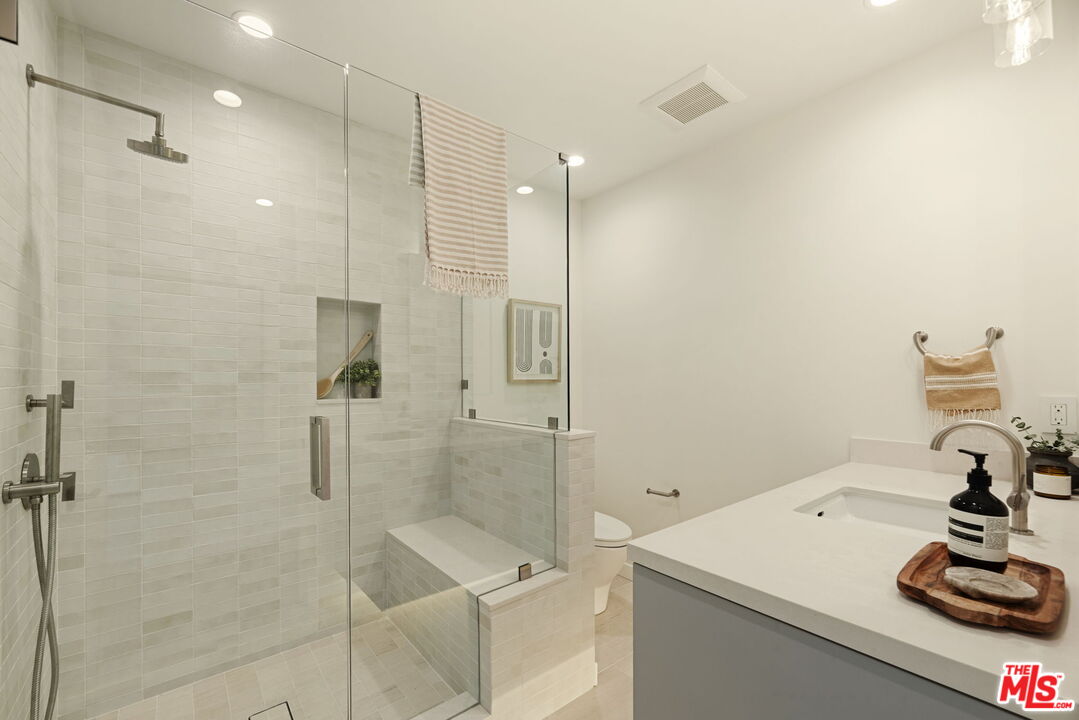 2165 Little Las Flores Road Topanga, CA 90290 - Photo 23 of 40 a bathroom with a shower sink and a mirror