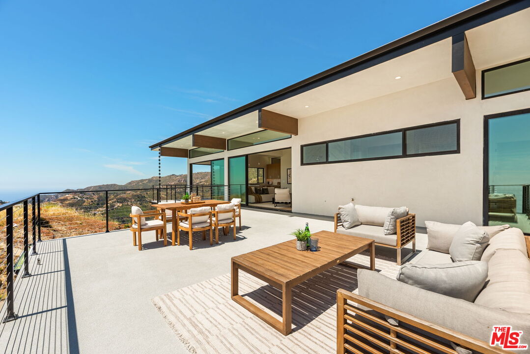 2165 Little Las Flores Road Topanga, CA 90290 - Photo 34 of 40 a outdoor living space with furniture and city view