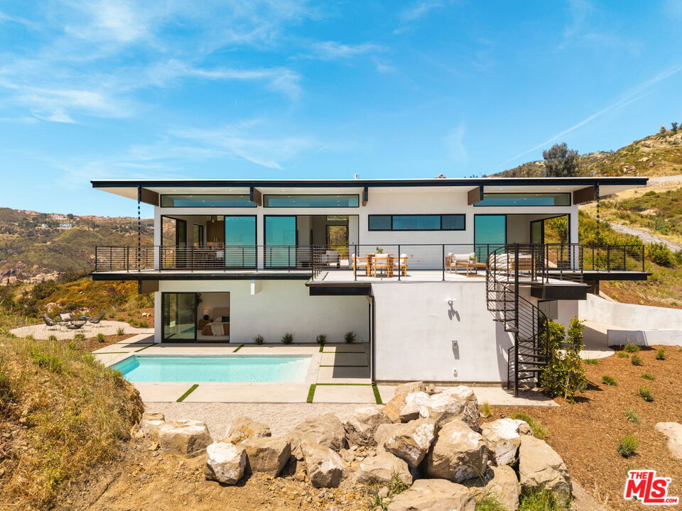 2165 Little Las Flores Road Topanga, CA 90290 - Photo 35 of 40 a front view of a house with a yard