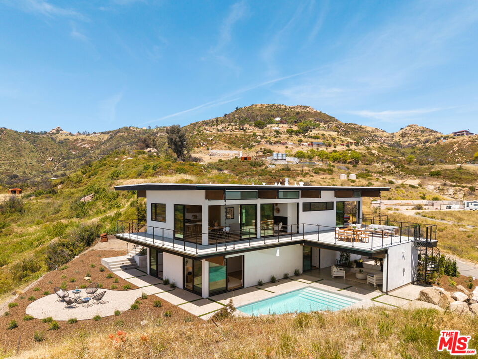 2165 Little Las Flores Road Topanga, CA 90290 - Photo 40 of 40 a view of a large building with a mountain view