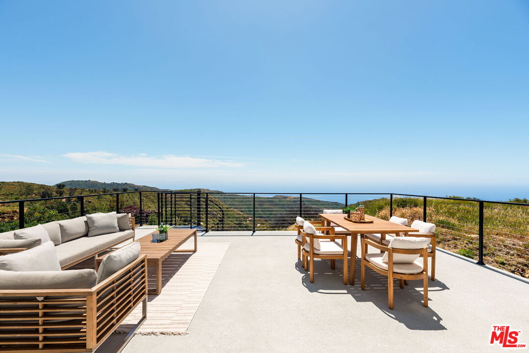 2165 Little Las Flores Road Topanga, CA 90290 - Photo 4 of 40 a terrace with outdoor seating and city view
