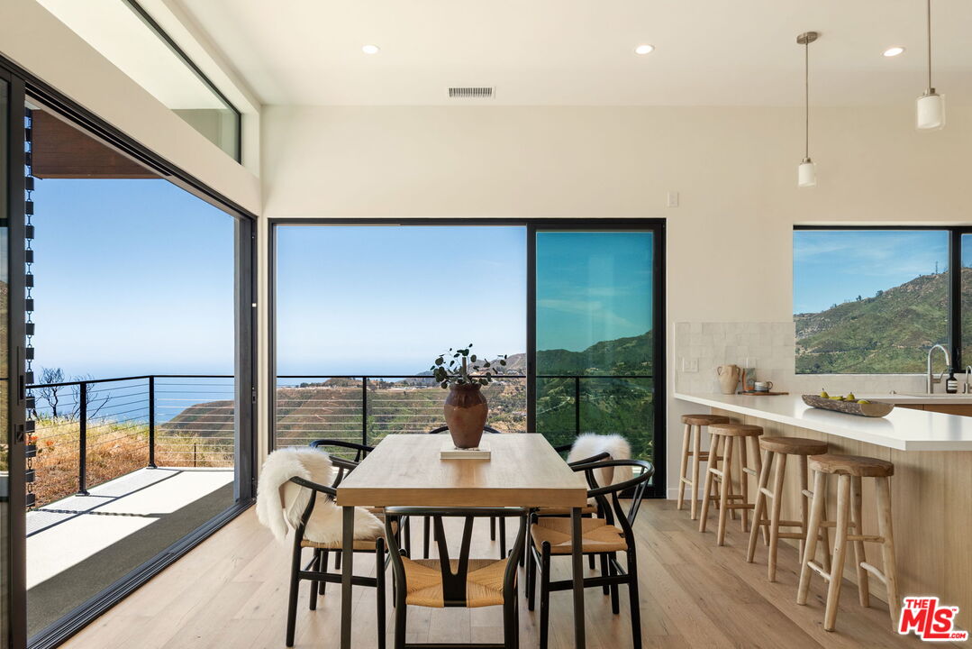 2165 Little Las Flores Road Topanga, CA 90290 - Photo 6 of 40 a view of a dining room with furniture window and outside view
