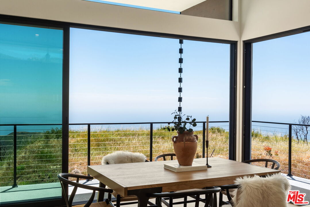 2165 Little Las Flores Road Topanga, CA 90290 - Photo 7 of 40 a view of a dining room with furniture and window