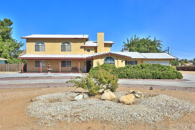 14311 Ricaree Road Apple Valley, CA 92307 - Photo 1 of 1 front view of a house with a outdoor space