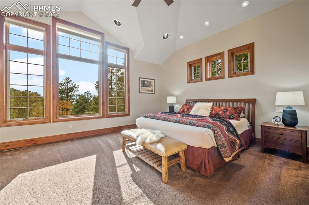 3833 Lorraine Road Larkspur, CO 80118 - Photo 11 of 40 a spacious bedroom with a large bed and a large window