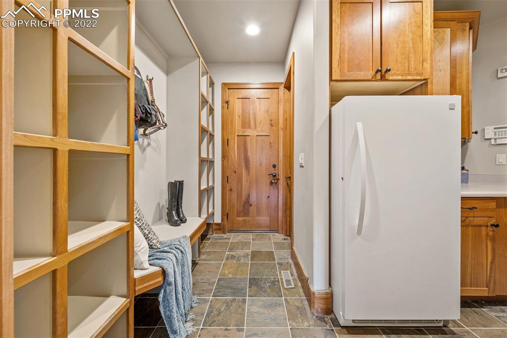 3833 Lorraine Road Larkspur, CO 80118 - Photo 18 of 40 a view of walk in closet with empty racks