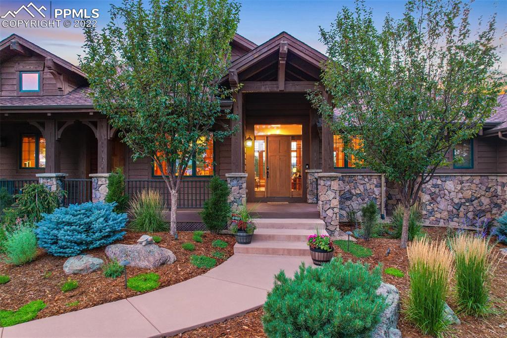 3833 Lorraine Road Larkspur, CO 80118 - Photo 2 of 40 a front view of a house with garden