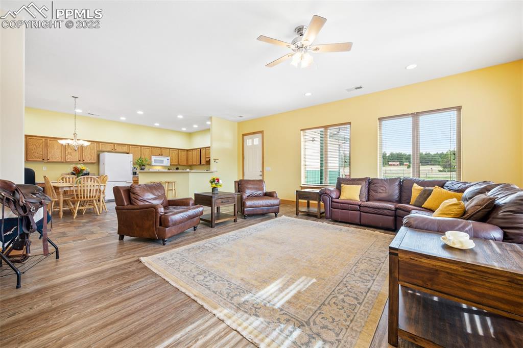 3833 Lorraine Road Larkspur, CO 80118 - Photo 28 of 40 a living room with furniture kitchen view and a large window