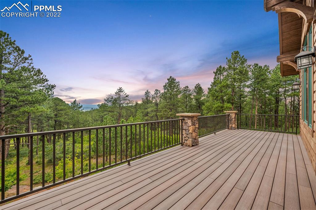 3833 Lorraine Road Larkspur, CO 80118 - Photo 10 of 40 a view of balcony with wooden floor and fence