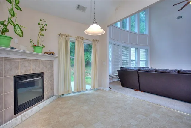 a view of a house with a backyard