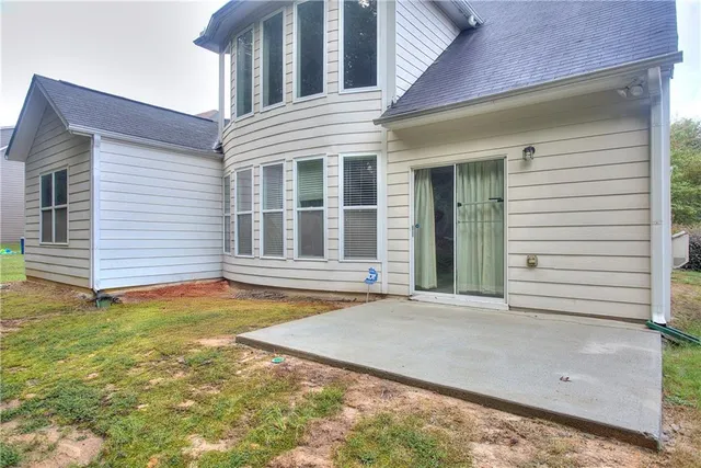 a living room with furniture and a large mirror