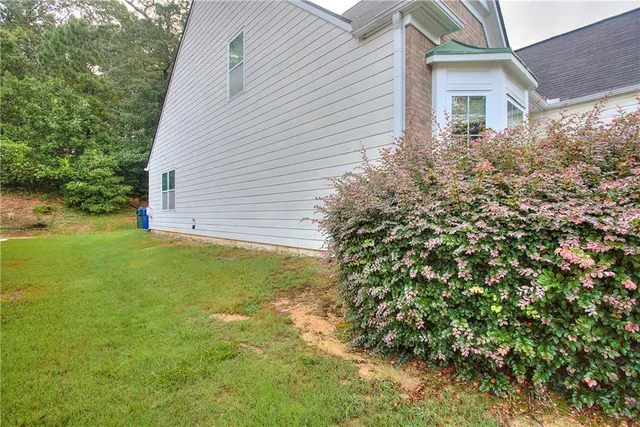 a kitchen with stainless steel appliances granite countertop a refrigerator stove and sink