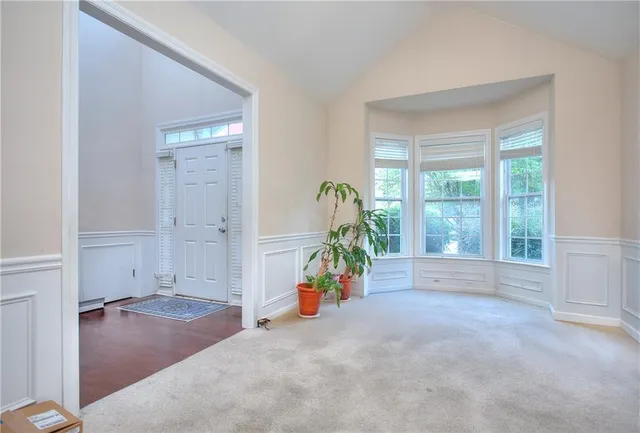 a en suite bathroom with a double vanity sink and a mirror