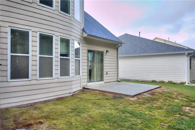 a view of a hallway with wooden floor and entryway
