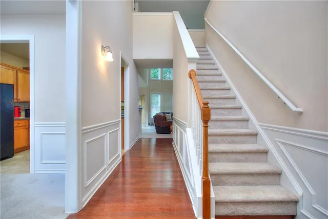 a view of entryway with wooden floor and stair