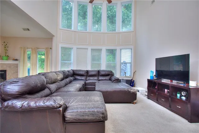 a kitchen with granite countertop wooden cabinets and a sink