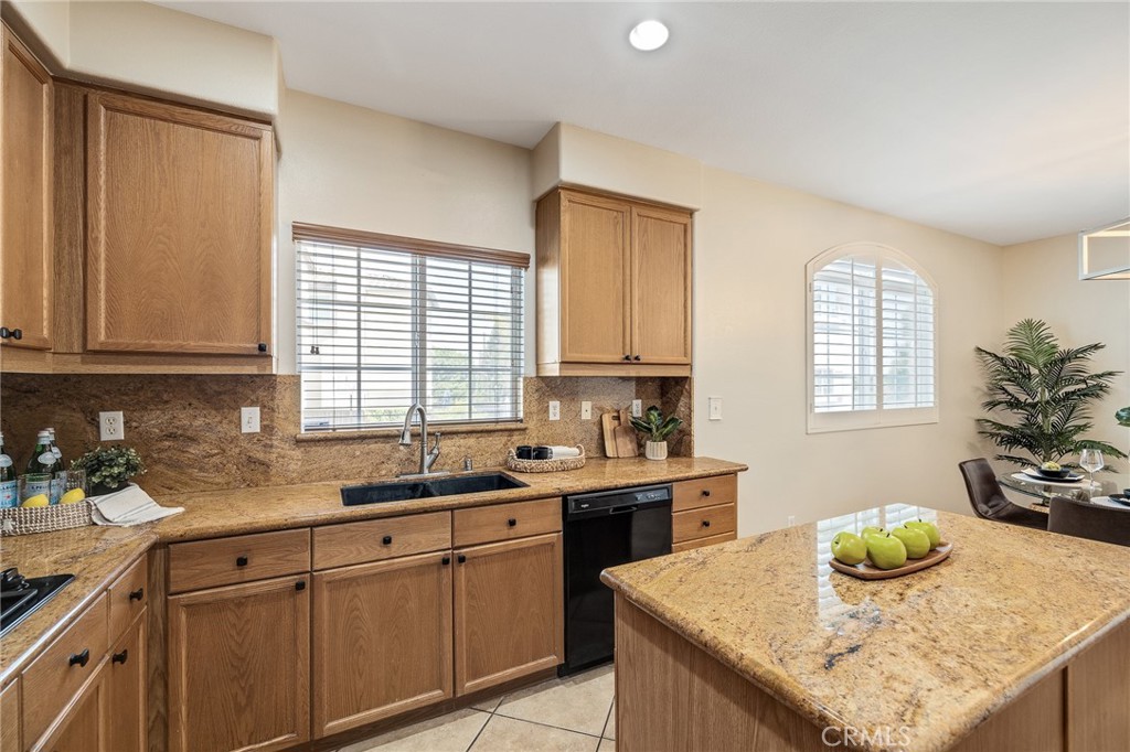 2786 Border Avenue Torrance, CA 90501 - Photo 18 of 47 a kitchen with granite countertop sink stove and cabinets