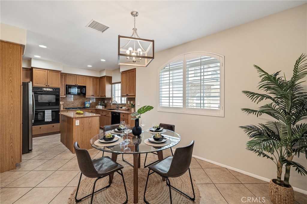 2786 Border Avenue Torrance, CA 90501 - Photo 24 of 47 a dining room with kitchen island stainless steel appliances kitchen island granite countertop furniture a window and kitchen view
