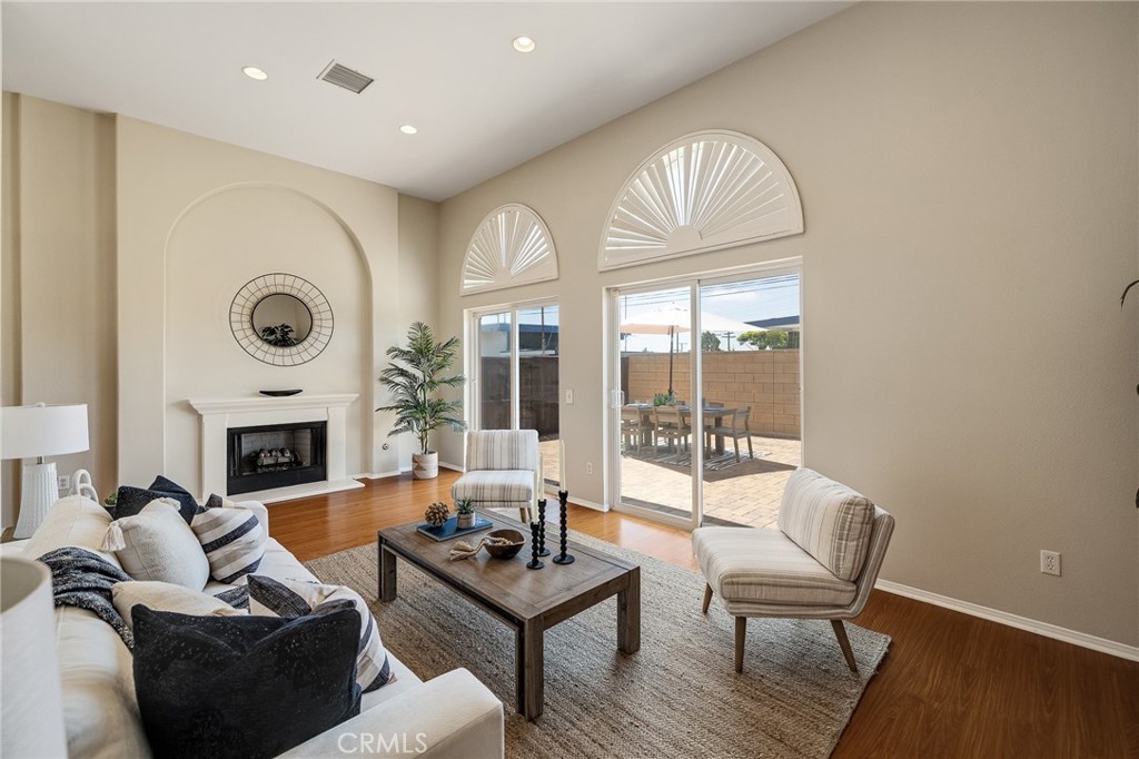 2786 Border Avenue Torrance, CA 90501 - Photo 3 of 47 a living room with furniture a fireplace and a floor to ceiling window