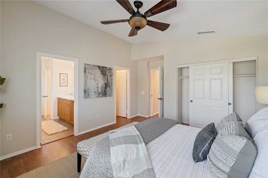 2786 Border Avenue Torrance, CA 90501 - Photo 39 of 47 a bedroom with a large bed and a chandelier fan