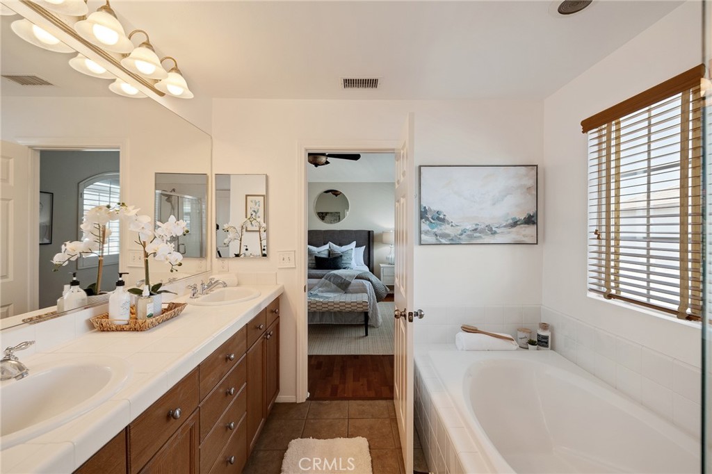 2786 Border Avenue Torrance, CA 90501 - Photo 42 of 47 a bathroom with a tub sink and mirror