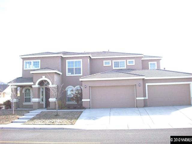 1696 Moquith Court Reno, NV 89521 - Photo 1 of 8 a front view of a house with parking