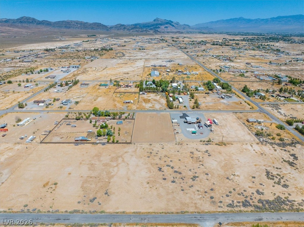 4610 Lawrence Road Pahrump, NV 89048 - Photo 33 of 42 Acres of vacant land await your vision, offering limitless possibilities for development against a mountain backdrop.