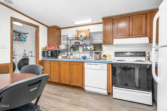 a living room with furniture a rug and a fireplace