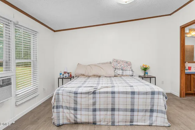 a view of a dining room with furniture wooden floor and chandelier