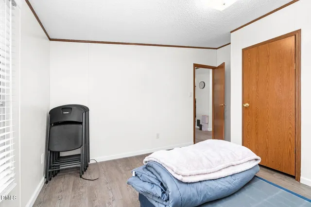 a room with a bed and a window