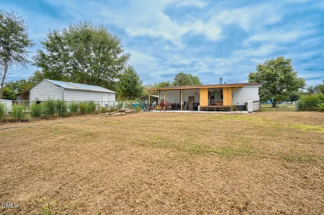 a view of a dinning room with furniture and a backyard