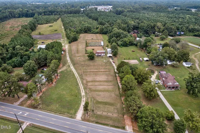 a view of a garden with an ocean view